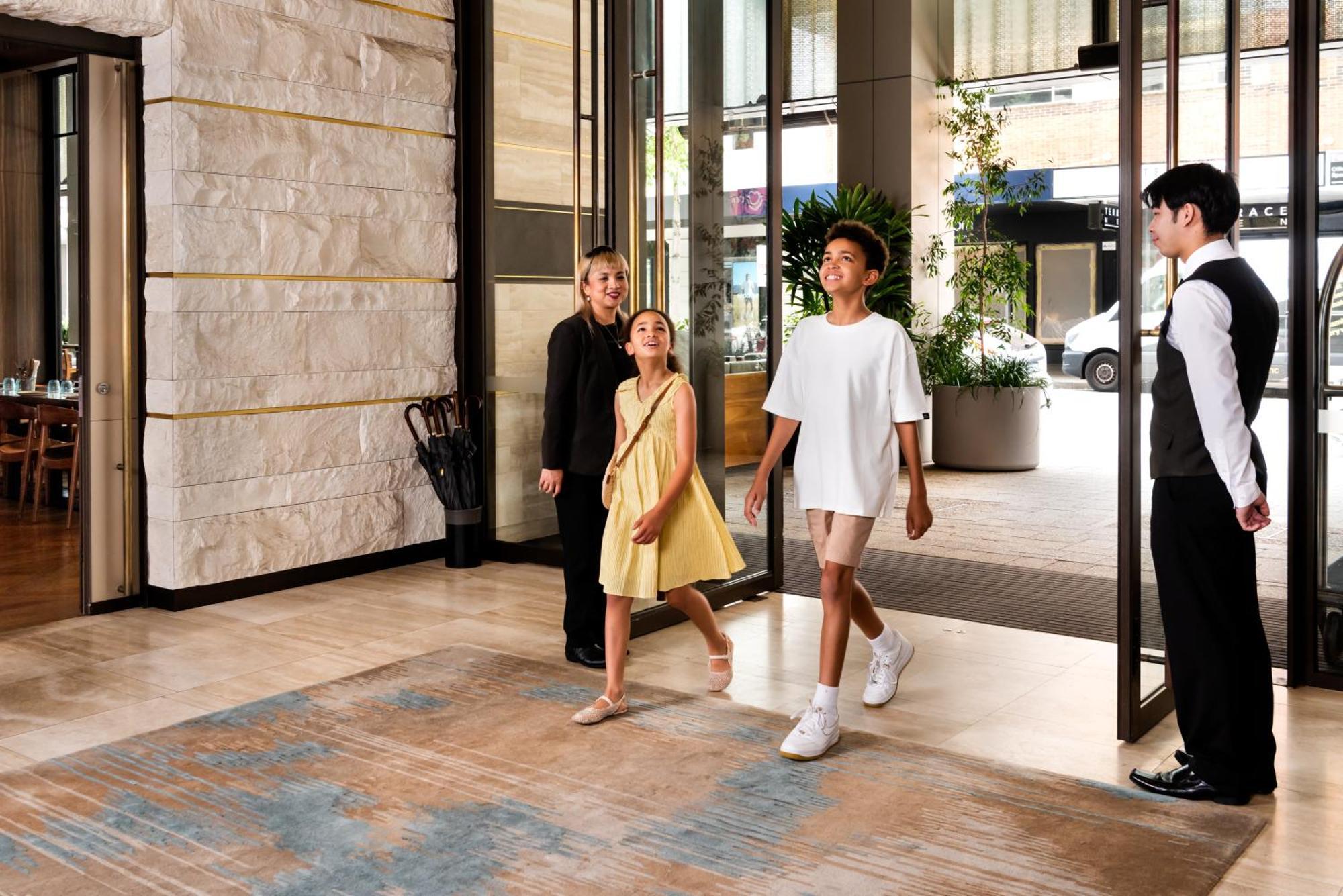 Intercontinental Perth City Centre By Ihg Exterior photo A doorman holding the door open for a guest